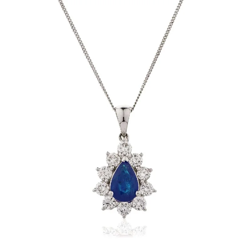 Stunning necklaces and pendants with turquoise and gold for a vibrant, earthy look-Pear Cut Sapphire Pendant with Diamond Halo