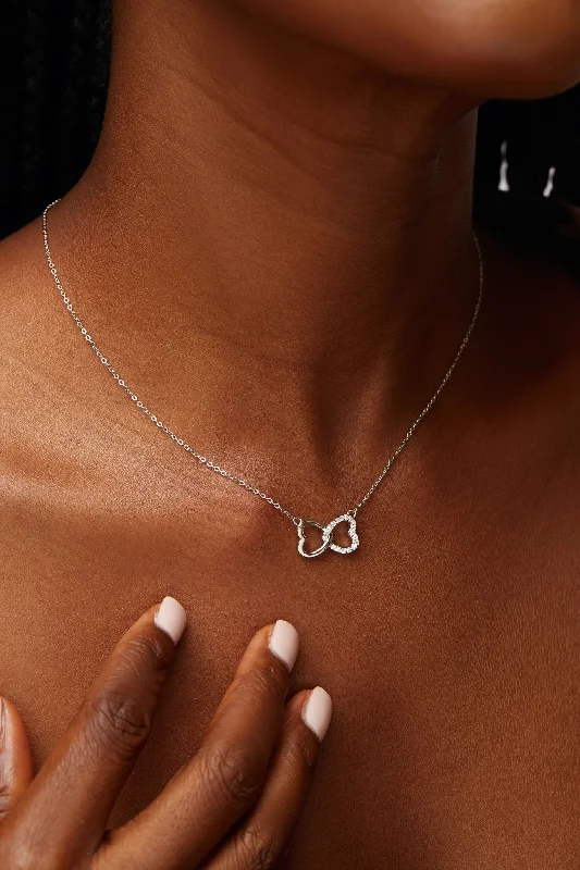 Necklaces and pendants with infinity love symbols for an eternal, romantic gesture-Andra Interlocked Heart Moissanite Necklace in 925 Sterling Silver