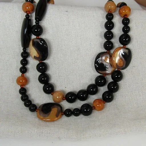 Layered necklaces and pendants for a trendy and fashionable stacked look-African Kazuri Necklace in Tan and Black Fair Trade Beads