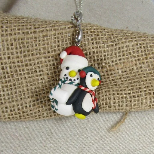 Best necklaces and pendants with intricate filigree for vintage-inspired elegance-Cute Snowman & Penguin Pendant Necklace