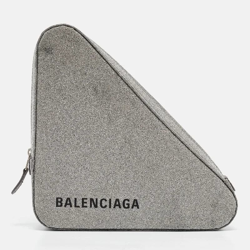 Handle bags with bright florals for cheer -Balenciaga Silver Glitter Triangle Clutch