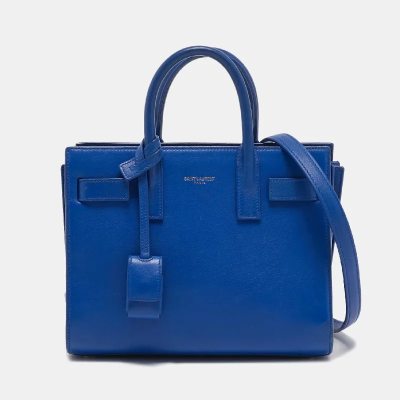 Handle bags with playful pom-poms for charm -Saint Laurent Blue Leather Nano Classic Sac De Jour Tote