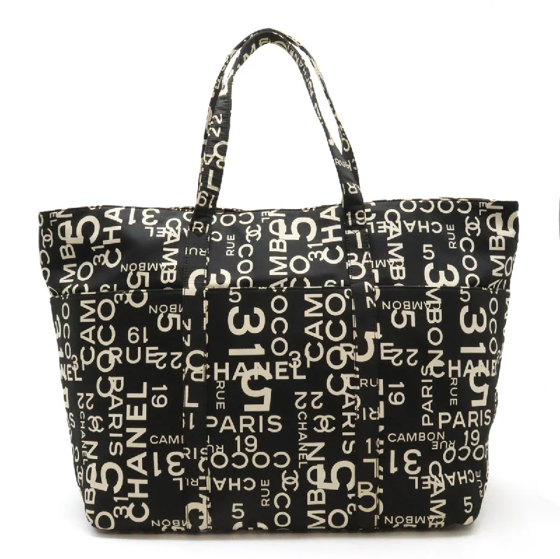 Handle bags with tie-dye patterns for fun -Chanel Canvas Logo Tote Bag with Plastic Chain