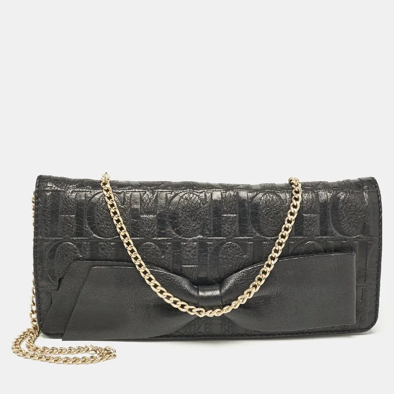 Handle bags with rustic leather for charm -Carolina Herrera Black Monogram Embossed Leather Bow Flap Chain Clutch